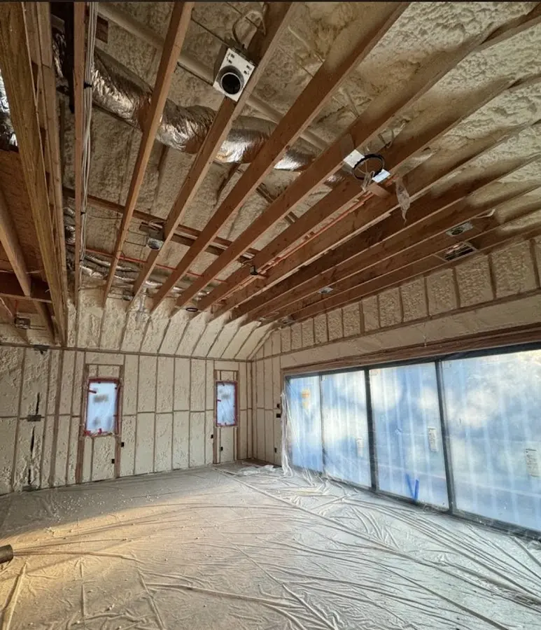 Interior walls and ceiling insulated with spray foam during new construction in Willowick